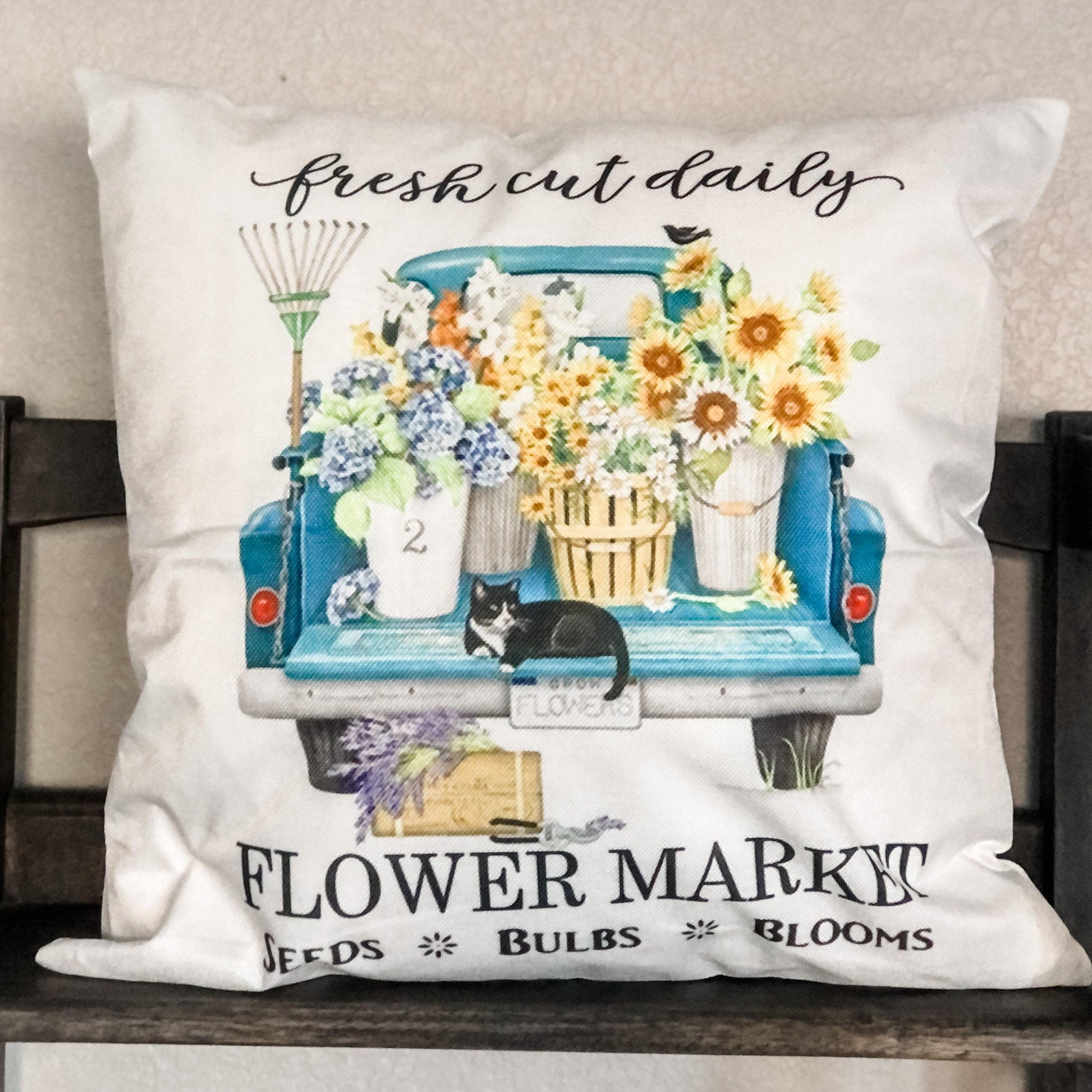 https://vineandnest.com/cdn/shop/products/spring-pillow-covers-8-options-blue-truck-flowers-320.jpg?v=1666726088&width=1946